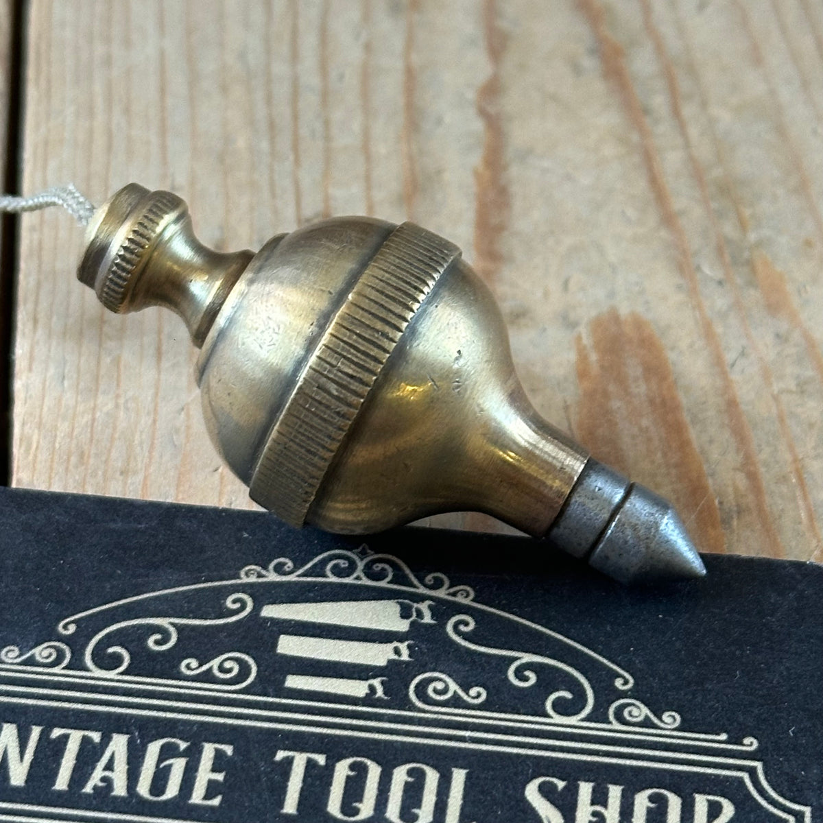 D1508 Vintage FANCY ORB shaped brass PLUMB BOB